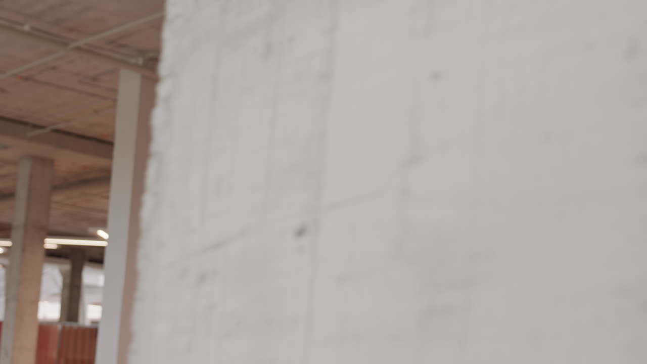 Foreman Talking on Phone Walking