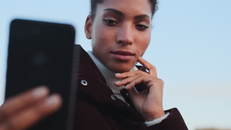 african american girl taking selfie.