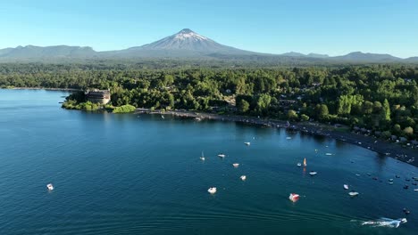 aerial over villarrica lake hotel bay to the volcano mountain, chile