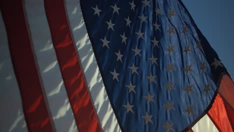 closeup of american flag blowing in slow motion