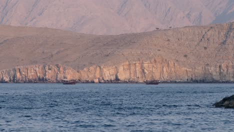 Calm-sunny-view-of-Khasab-hills-and-sea,-sightseeing-in-open-waters