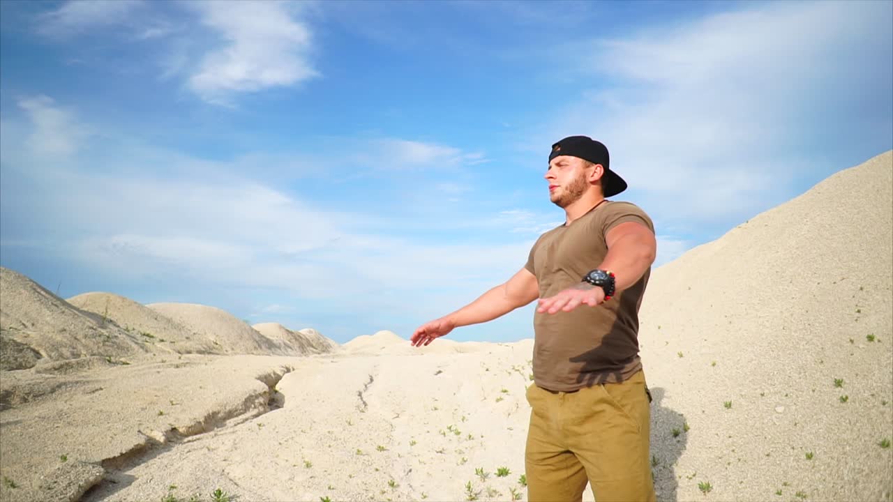 Man stretching in a desert landscape
