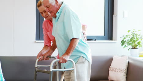 a senior woman helping a senior man standing