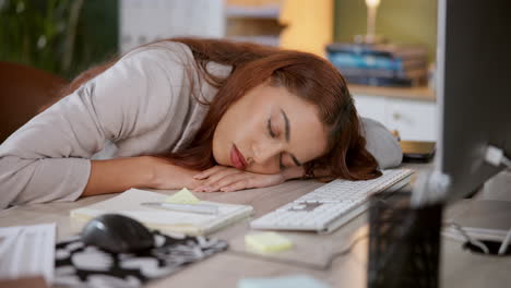 tired woman sleeping at her desk