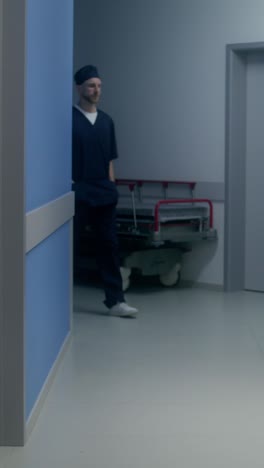 doctor consults with patient in hospital hallway