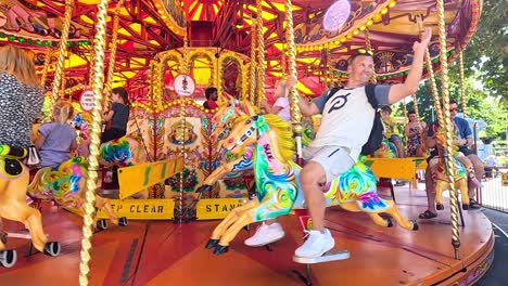 people enjoying a colorful carousel ride