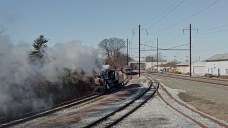 An-Aerial-View-of-a-Steam-Locomotive-Backing-Up-to-Connect-to-a-Passenger-Train