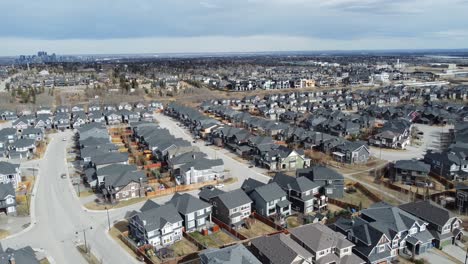 aerial view of a modern suburban community in calgary, canada, in spring after the snow melt