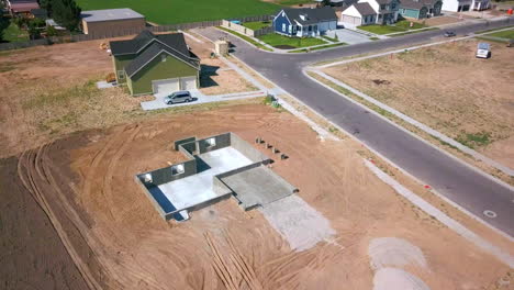 A-drone-shot-spinning-around-a-foundation-and-basement-walls-that-had-just-been-poured