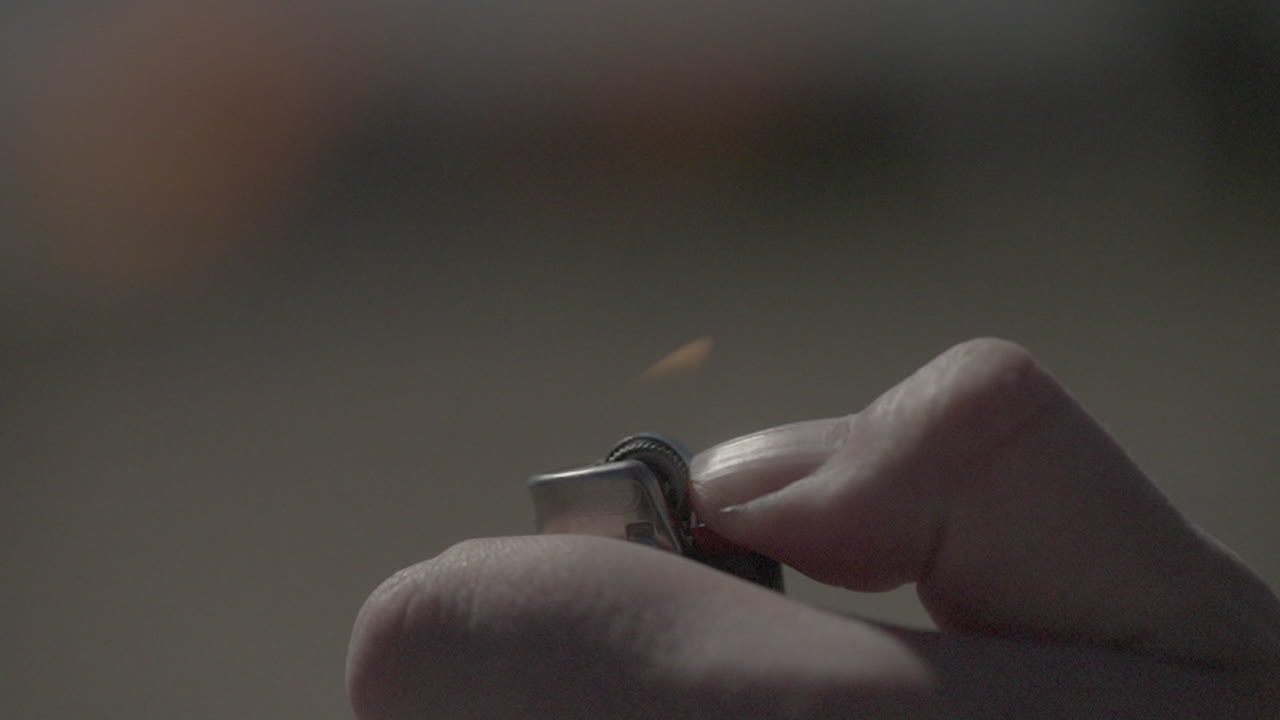 Hand Lighting a Lighter