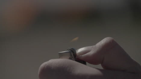 hand lighting a lighter