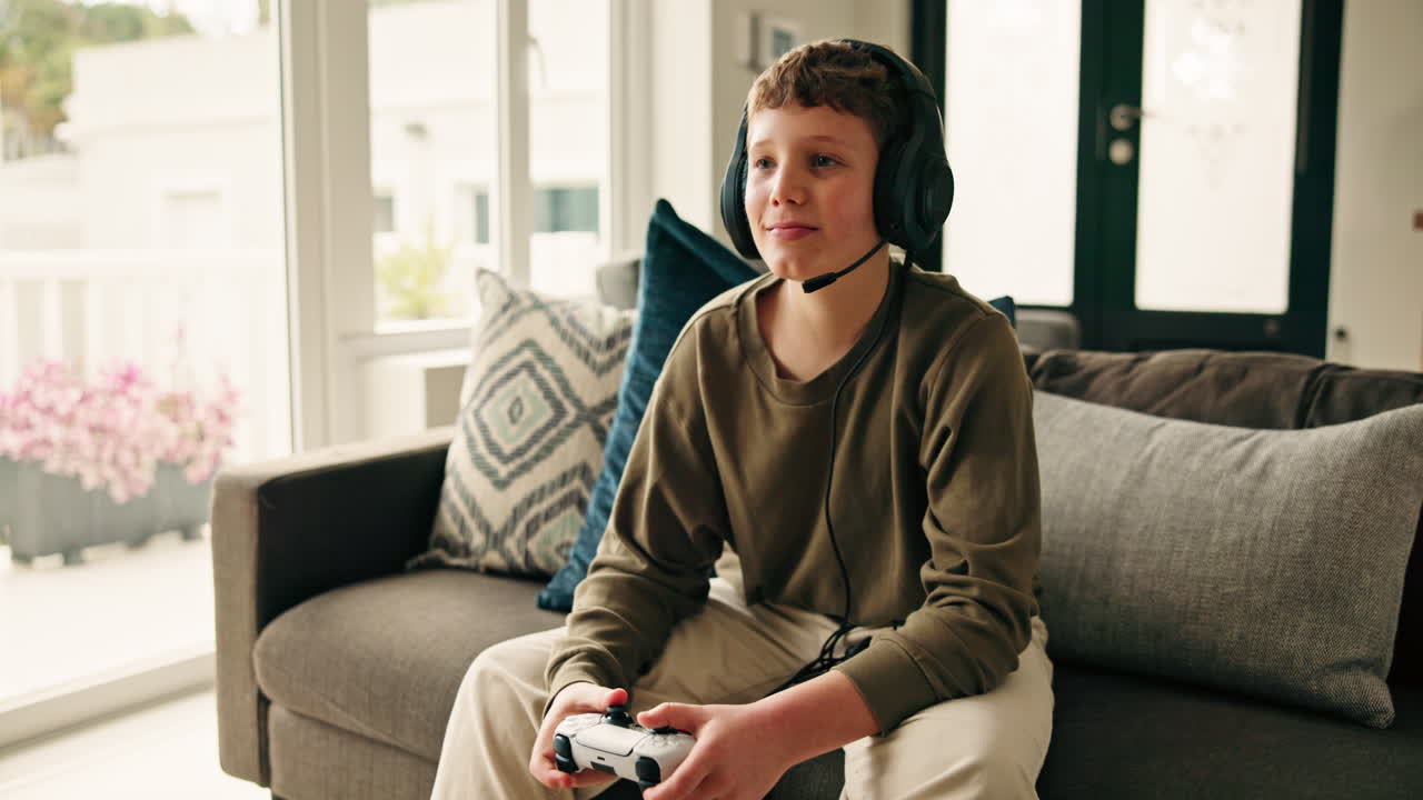 Boy playing video games at home