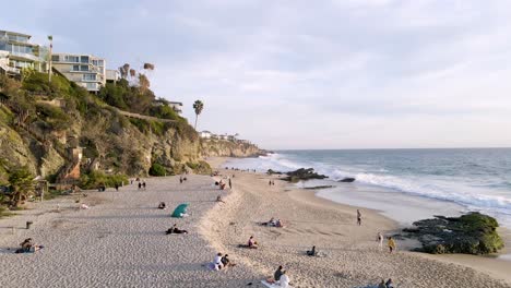 Aerial-view-of-Thousand-Steps-Beach,-Laguna-Beach,-California,-wide-forward-shot-dolly-right