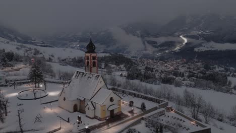 italian daiano snowy village in val di fiemme by day turning into night