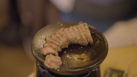 sliced steak on hot plate