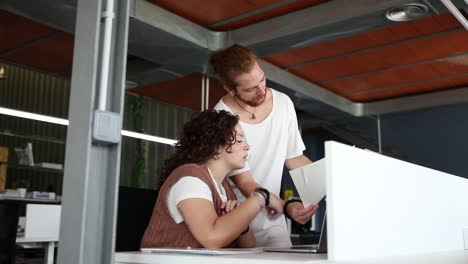 Focused-colleagues-working-with-documents-in-office