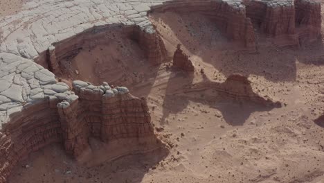 orbiting aerial view of unique sandstone rock formations in the utah desert near hanksville utah