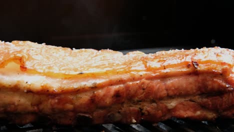 juicy smoked grilled pork belly meat on grill barbecue