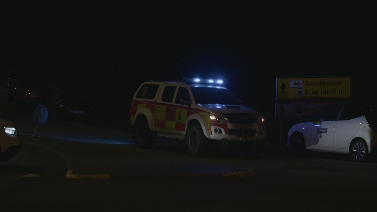 A police car blocks the road leading to the site of the Grindavik volcano eruption in Sundhnúkur crater, Iceland.