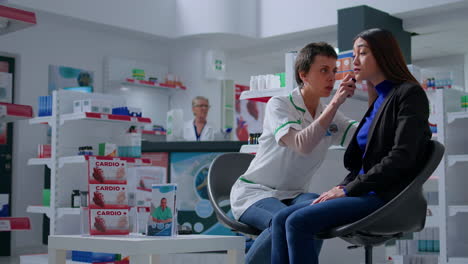 pharmacist doing annual ear exam