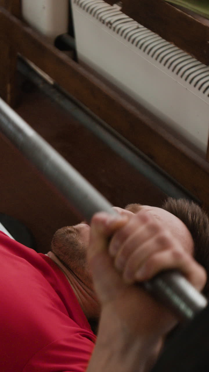 Man engaged in weightlifting exercise