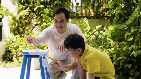 asian man and boy in the backyard