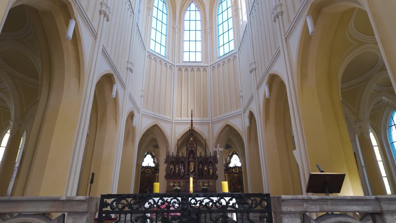 Gothic interior of the Cathedral of Assumption in Kutná Hora, Czech Republic, featuring tall arches