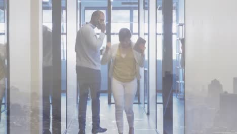 happy asian businesswoman celebrating in office corridor after meeting, over cityscape
