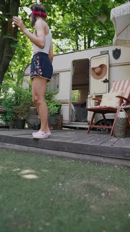 woman enjoying a relaxing day by her camper