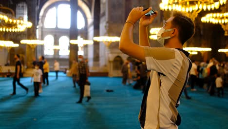 Masked-man-taking-pictures-inside-Hagia-Sophia