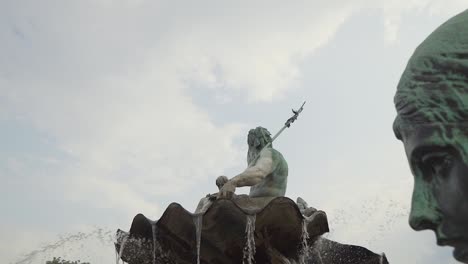 neptune fountain ancient artwork statues in berlin, germany