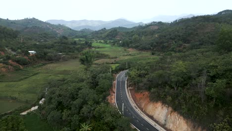 aerial view of winding road through valley and mountains
