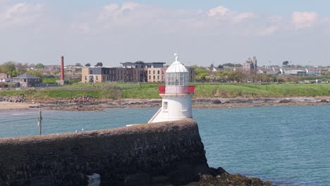 lighthouse in the harbor of balbriggan in fingal, dublin, ireland. - aerial shot