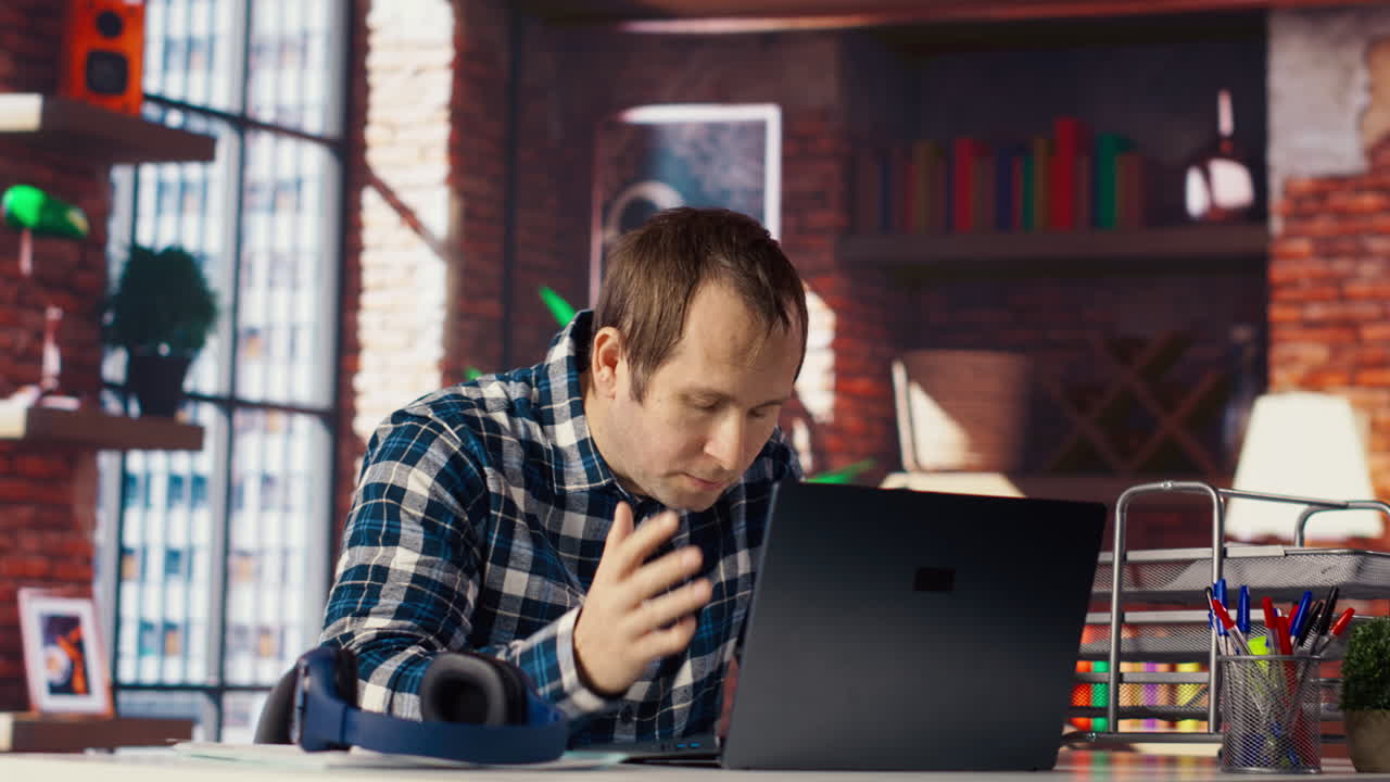 Manager calls employee using internet videocall to offer negative feedback