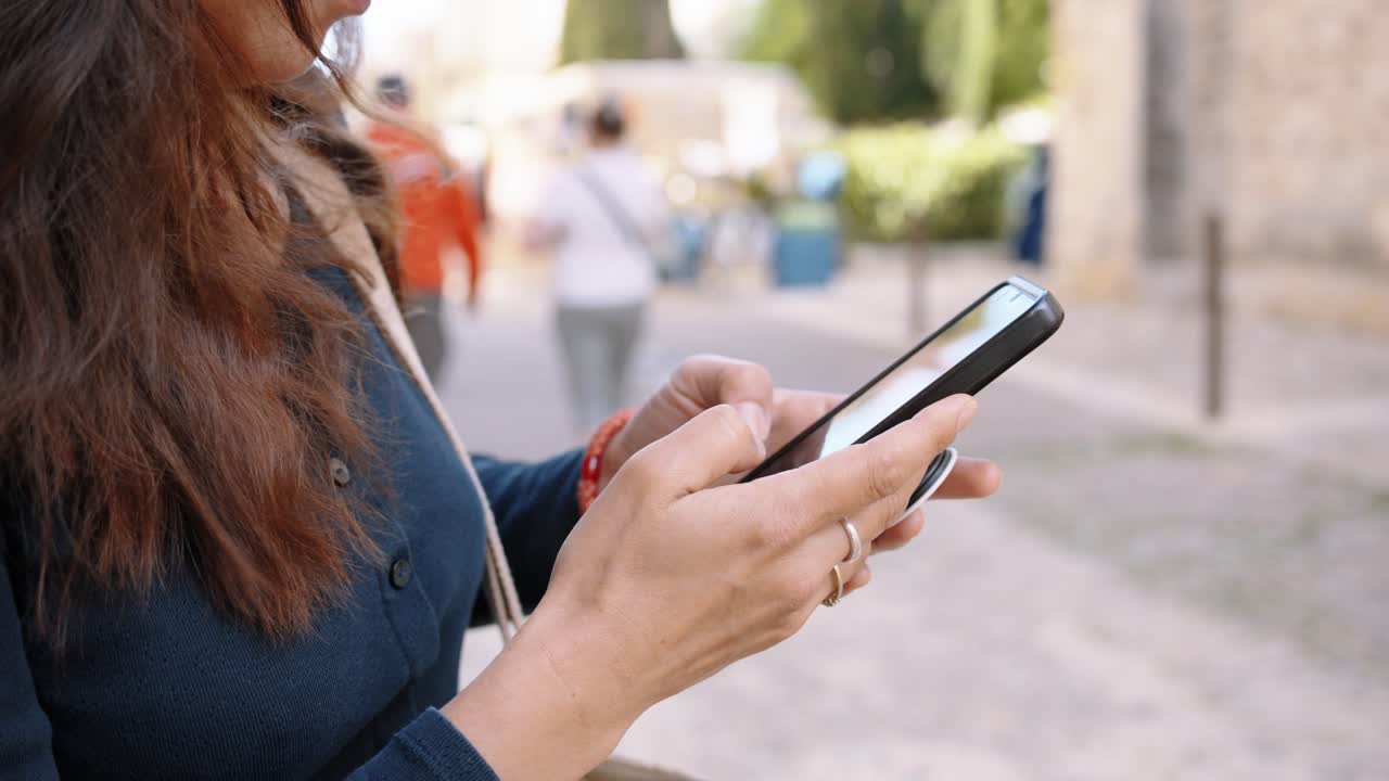 Urban moment with woman on smartphone