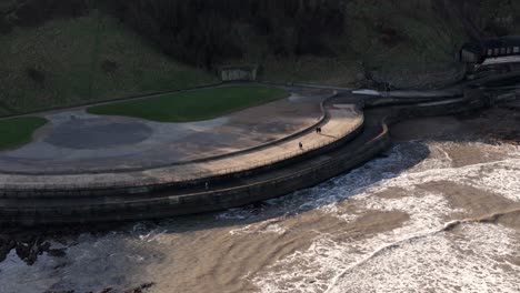 aerial shot of sea defence scarborough in the uk