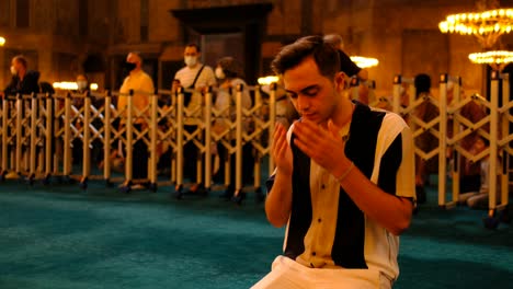 young prayer inside hagia sophia