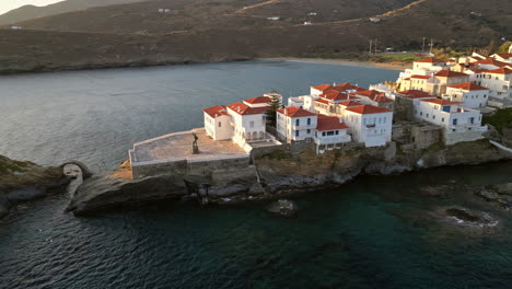 Aerial-view-video-of-iconic-Andros-island-chora,-Cyclades,-Greece-at-dusk