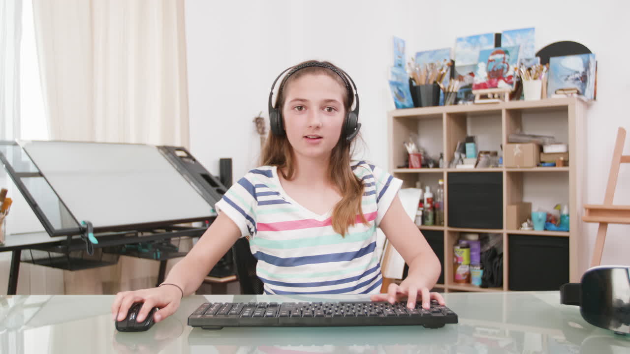 Girl using computer at home