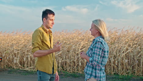 farmers discussing in a cornfield