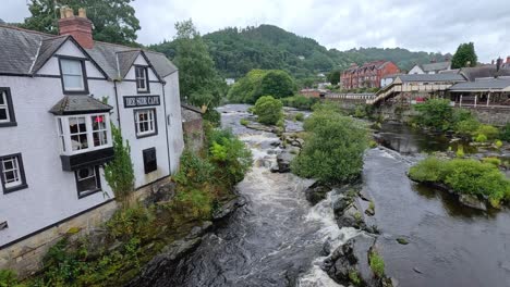 picturesque town with river and historic buildings