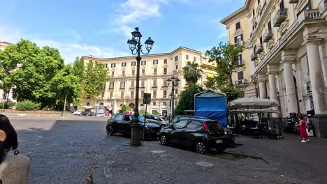 woman walking through a historic city square