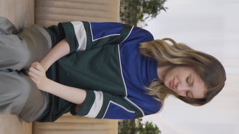 Vertical-video-of-The-young-woman-who-smells-good-is-happy.