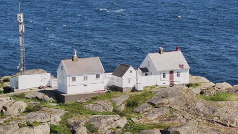 stavernsodden small lighthouse stands on rocky coastal sea of larvik in norway