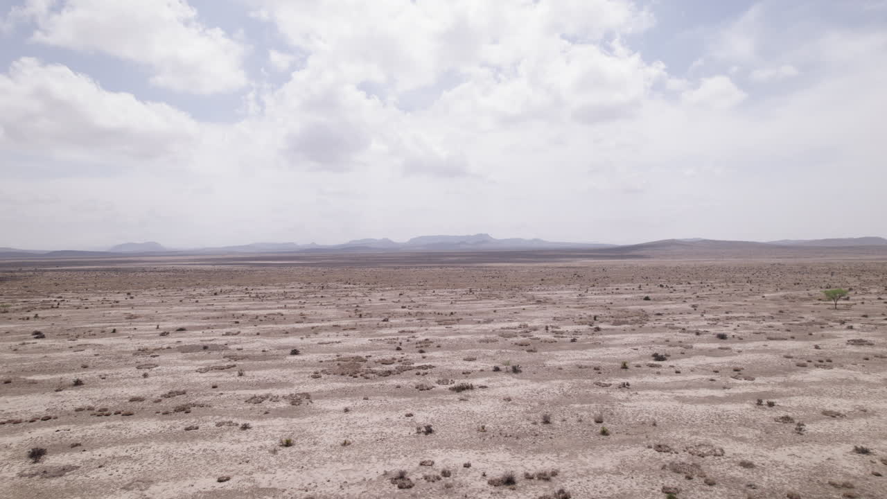 The West Texas Chihuahuan Desert in the Big Bend Region, aerial view rises over sparse sandy landscape
