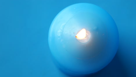 burning blue candle