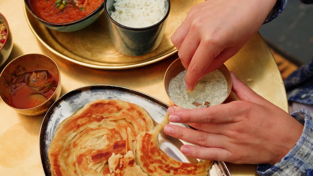 Woman enjoying Indian food