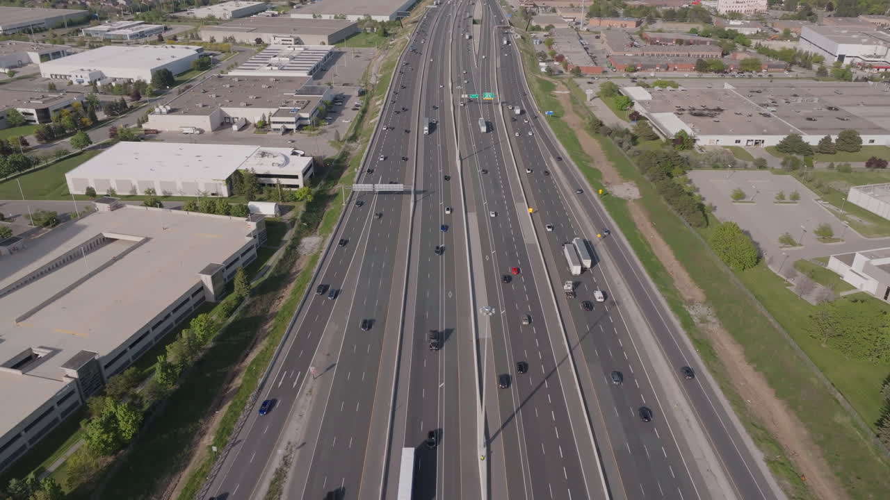 Highway 401 in mississauga with moving vehicles in slow motion, aerial view