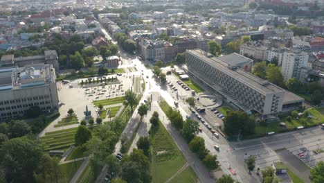 Aerial-drone-backward-moving-shot-of-urban-city-of-Krakow,-Cracow,-Poland-during-evening-time