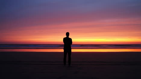 silhouette of a man at sunset on the beach